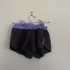 Maroon and purple Reebok athletic shorts